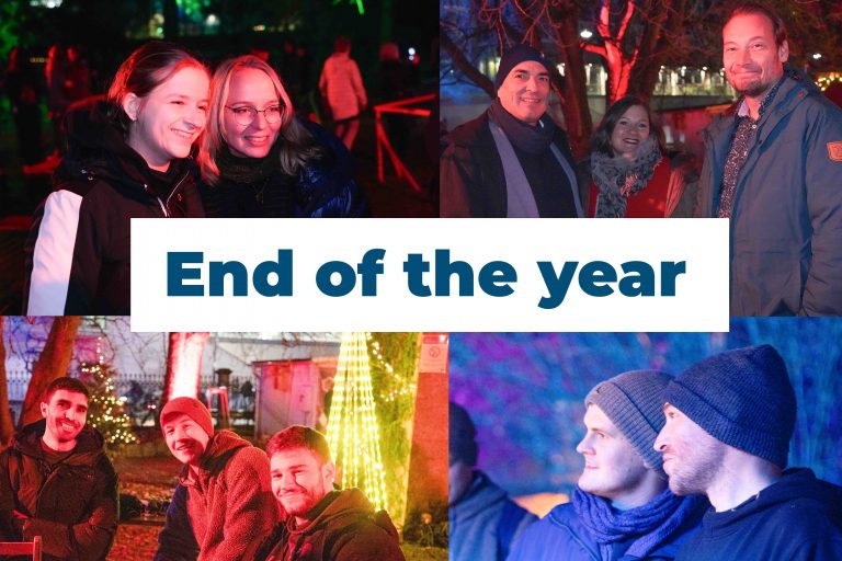 HIPOLE Jena end-of-year gathering with team members outdoors at night.